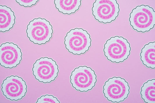 A grid of JaneLi.Co stickers of white fish cakes with pink swirls that say "Can't stop spiraling" over a pink background.