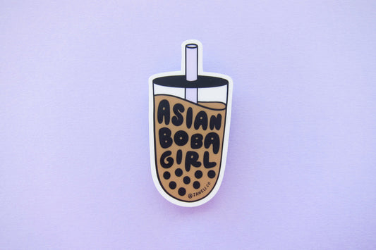 A JaneLi.Co sticker that says "Asian Boba Girl" in the shape of a cup of boba over a lavender background.