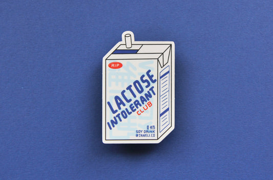 A JaneLi.Co sticker that says "Lactose Intolerant Club" in the shape of a soymilk carton with a straw over a navy blue background.