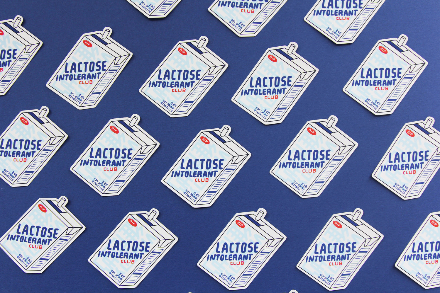 A grid of JaneLi.Co stickers that say "Lactose Intolerant Club" in the shape of soymilk cartons with straws over a navy blue background.