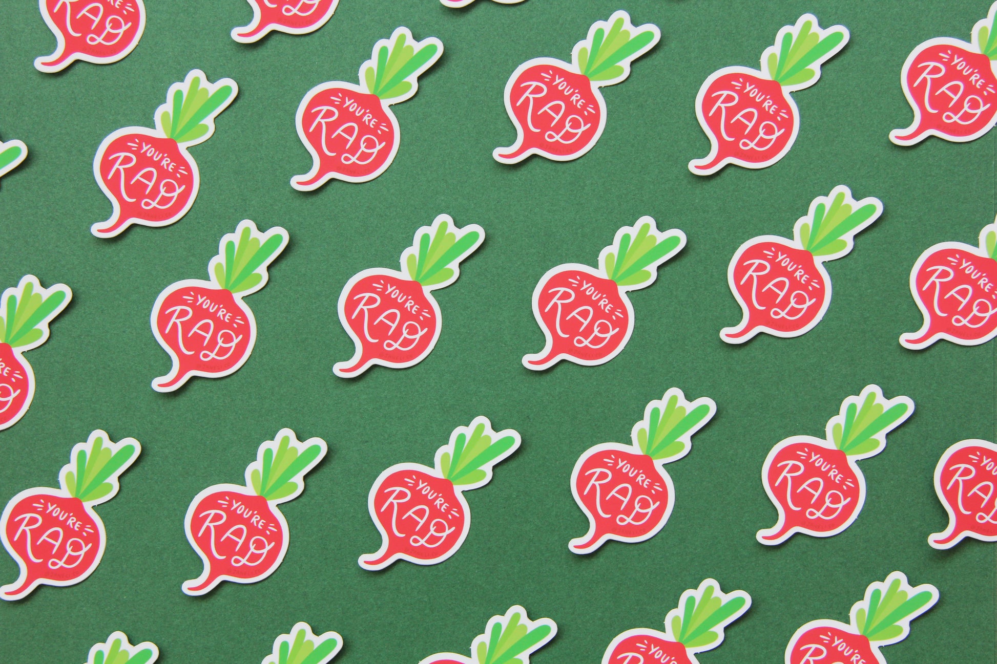 A grid of cute JaneLi.Co stickers that say "You're Rad" in the shape of small radished over a green background.