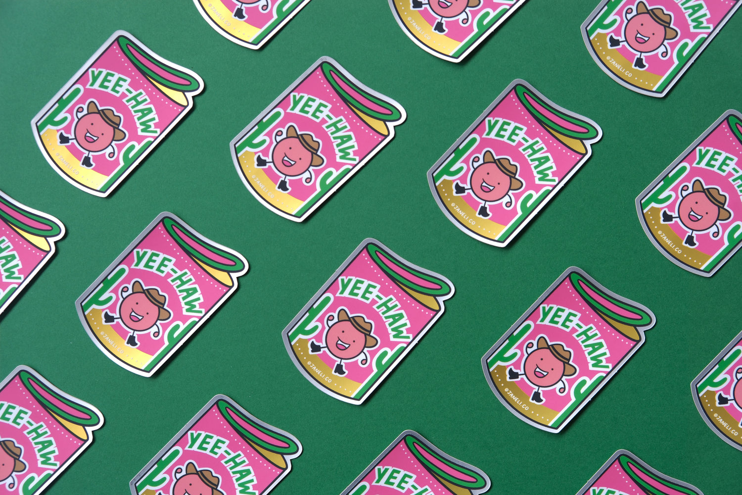   A grid of JaneLi.Co stickers of haw flakes with cowboy characters that say "Yee-Haw" over a green background.