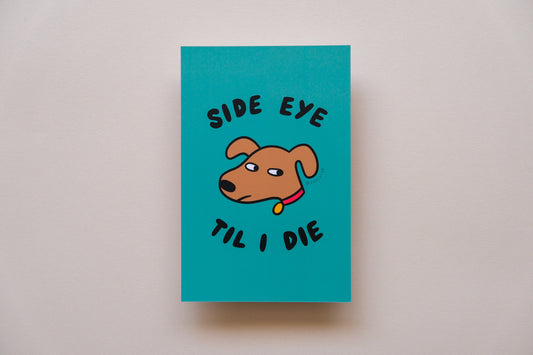 A JaneLi.Co mini print/postcard of a dog giving side eye that says "Side Eye" over a cream background.