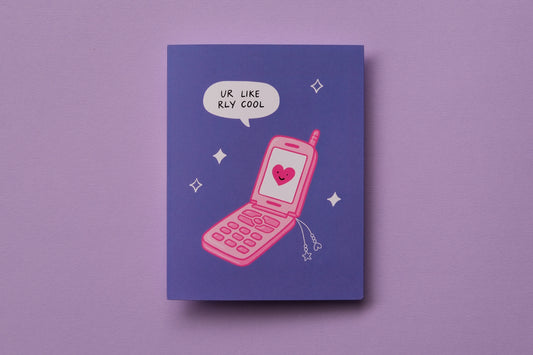 A photo of a greeting card that says "ur like rly cool" with a pink retro flip phone on a lavender background.
