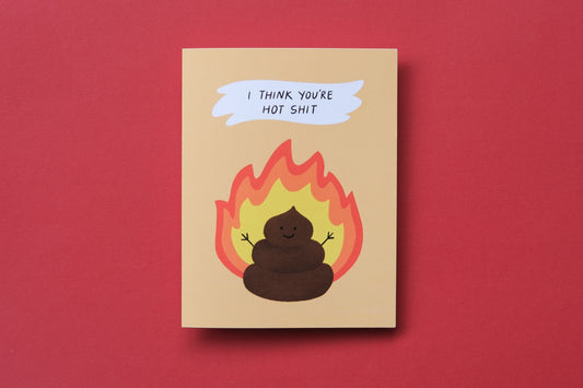 A photo of a greeting card with a flaming poop that says "I think you're hot shit" on a red background.