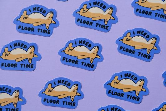 A grid of JaneLi.Co stickers of dogs lying on the floor that say "I need floor time" over a lavender background.