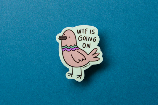 A JaneLi.Co sticker of a pigeon that says "WTF is going on" over a teal background.