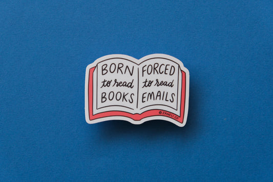 A JaneLi.Co sticker of an open book that says "Born to read books, forced to read emails" over a blue background.