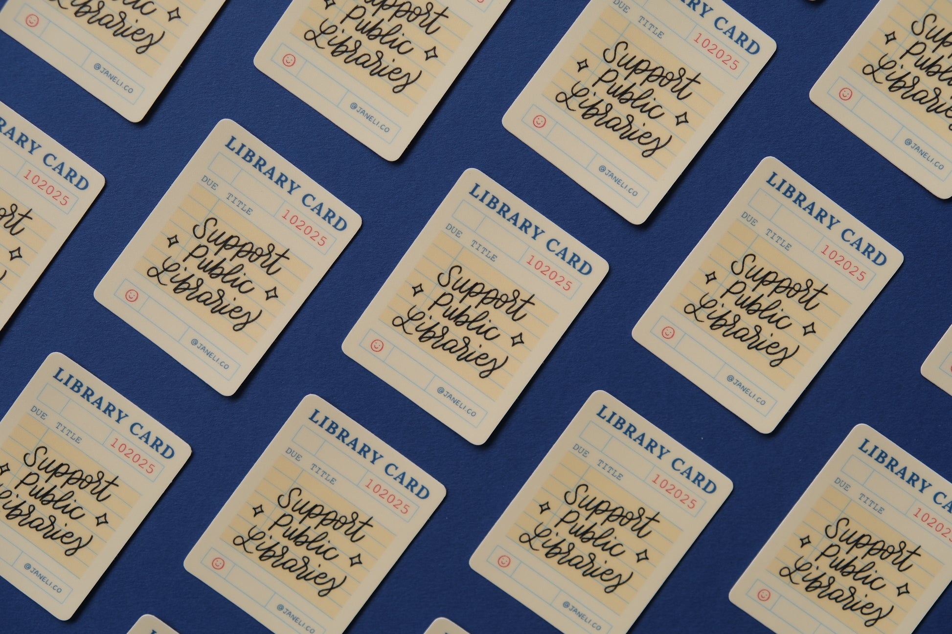 A grid of JaneLi.Co stickers of vintage library cards that say "Support Public Libraries" over a dark blue background.