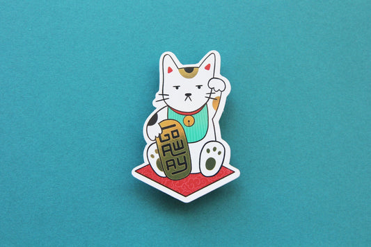 A JaneLi.Co sticker that shows a Maneki Neko cat holding a metallic gold bar that says "Go Away" over a teal background. 