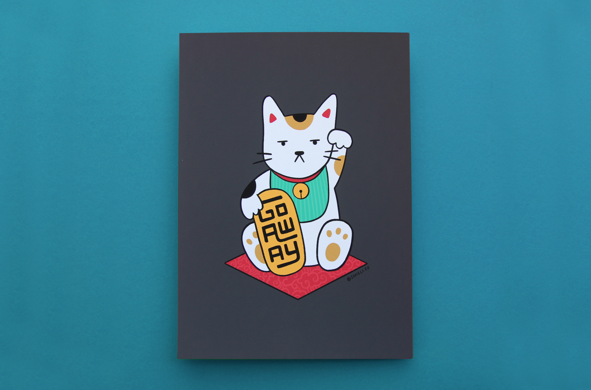 A JaneLi.Co print that shows a maneki neko cat holding a gold bar that says "Go Away" over a teal background.