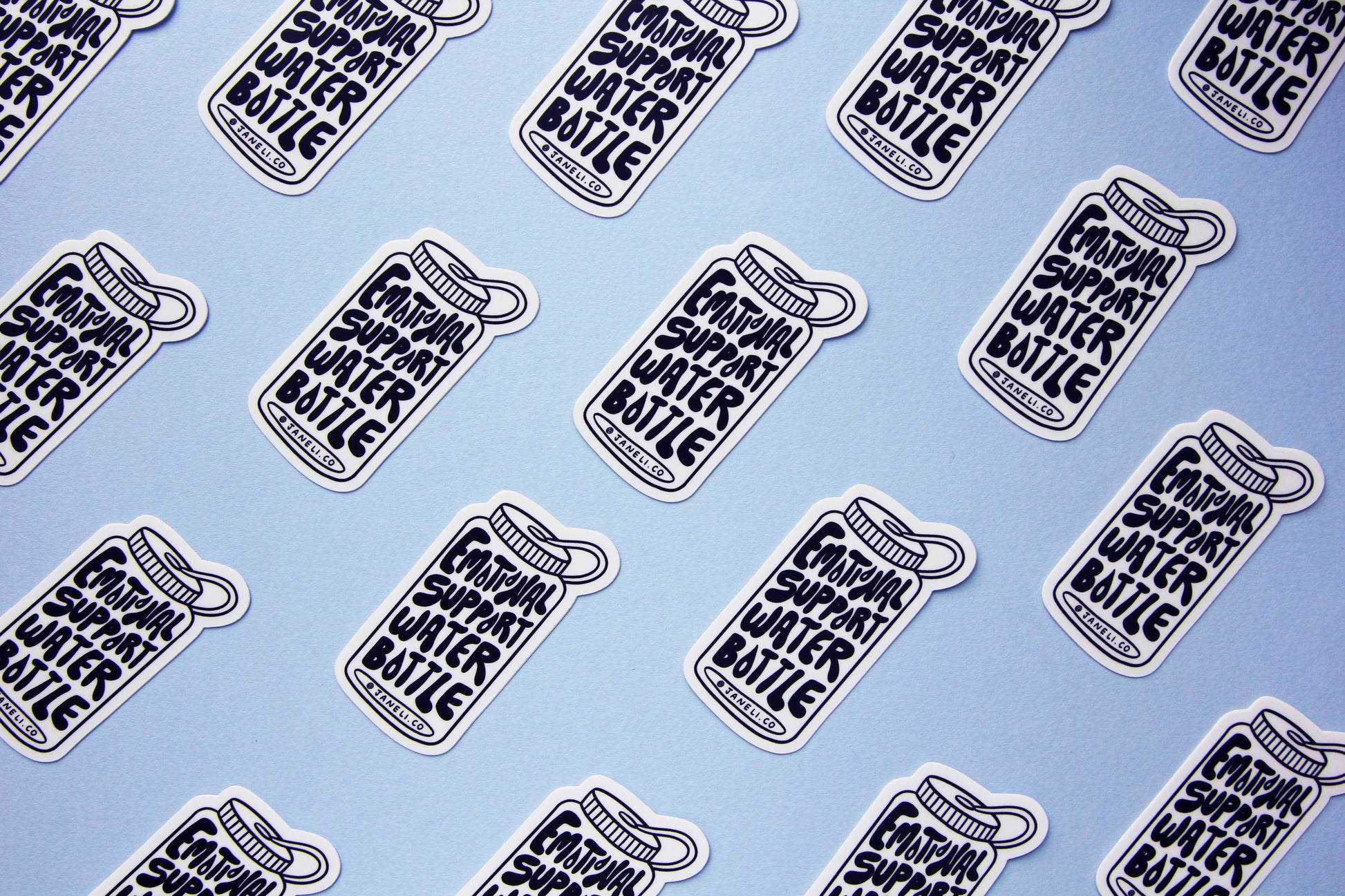 A grid of black and white JaneLi.Co stickers that say "Emotional Support Water Bottle" in the shape of a water bottle over a sky blue background.