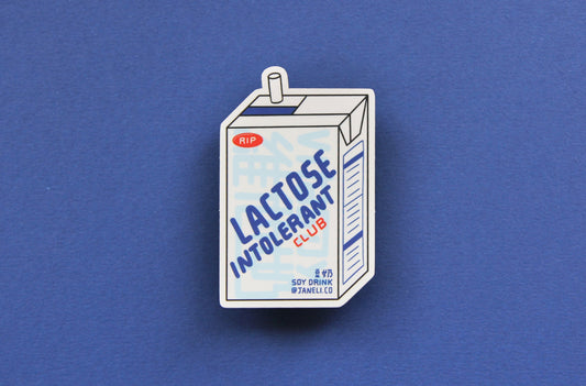 A JaneLi.Co sticker that says "Lactose Intolerant Club" in the shape of a soymilk carton with a straw over a navy blue background. 