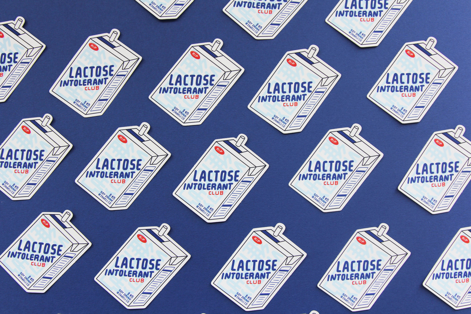 A grid of JaneLi.Co stickers that say "Lactose Intolerant Club" in the shape of soymilk cartons with straws over a navy blue background. 