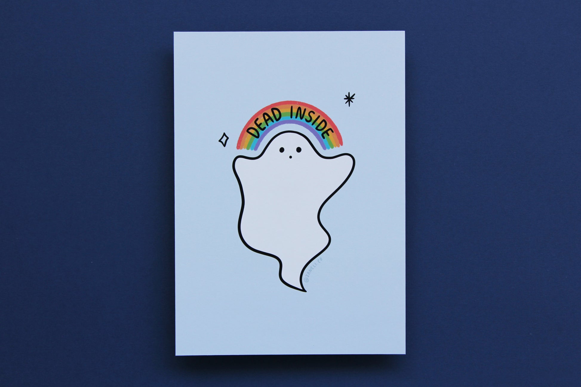 A JaneLi.Co print that shows a little white ghost holding up a rainbow that says "Dead Inside" over a navy blue background.