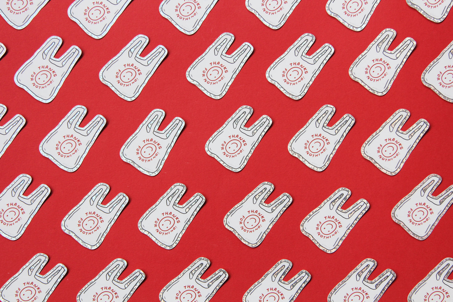 A grid of JaneLi.Co stickers that say "Thanks For Nothing" in the shape of plastic takeout bags over a red background.